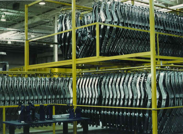 Overhead conveyor for automotive parts accumulation