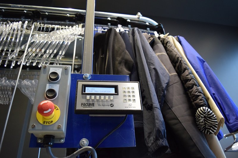 Automated storage and retrieval system for coat check conveyor