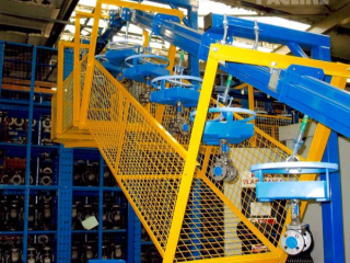 PAC-MAX Heavy Duty enclosed track conveyor used for auto part assembly line.