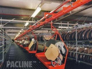 Custom carries built to move bicycles through assembly on PAC-MAX overhead conveyor system.