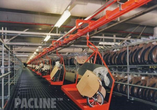 Custom carries built to move bicycles through assembly on PAC-MAX overhead conveyor system.