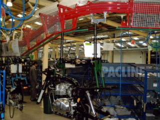 Heavy duty PAC-MAX overhead conveyor used to move motorcycles through assembly process.