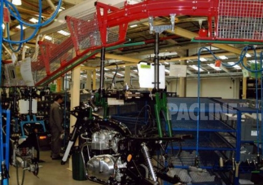 Heavy duty PAC-MAX overhead conveyor used to move motorcycles through assembly process.