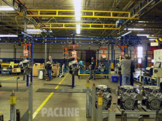 The PAC-BEAM I beam conveyor is used to transport heavy automotive engines through the assembly process.