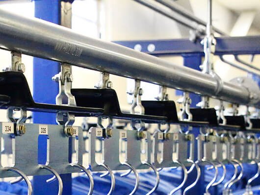 Photos of recently installed garment handling conveyor systems.