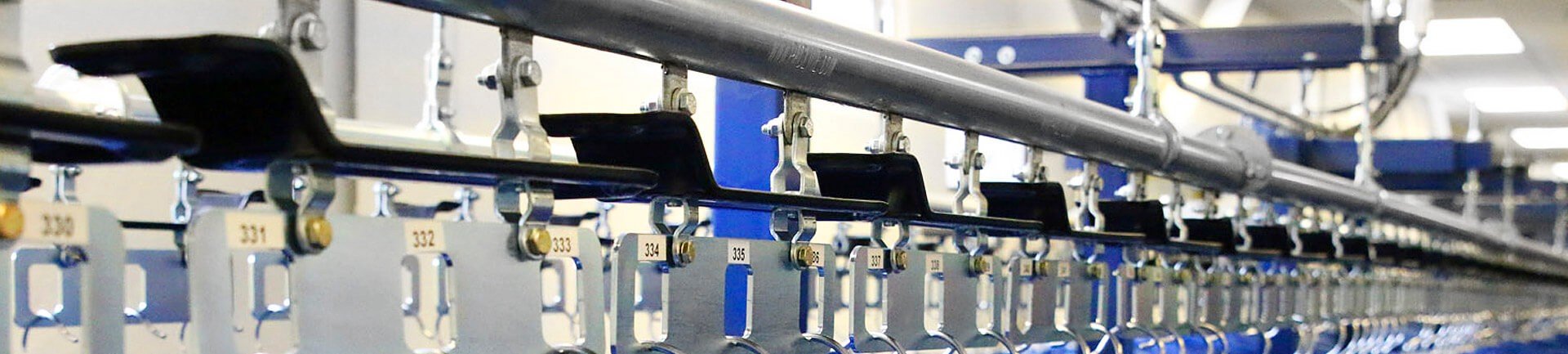 Automated garment conveyor for uniform and inmate property storage and retrieval