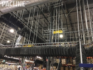 PAC-LINE™ enclosed track overhead conveyor for storing backpacks and other promotional Items.