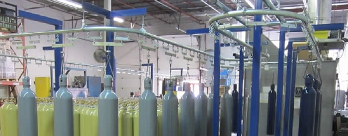 Monorail conveyor for cylinder tank finishing
