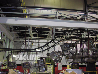 Manufacturer uses I beam conveyor to transfer stainless steel sinks through cleaning system.