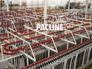 Power and free conveyor used to close pack automotive headliners for WIP live storage.