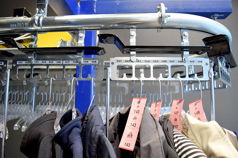 Coat check conveyor with checks