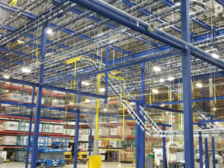 Conveyor for air drying military vests prior to final production assembly