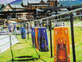 Colorado resort uses an enclosed track monorail conveyor to transport their sleds to the top of their alpine slide.