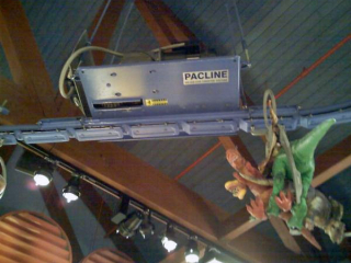 Toys were placed in a toy store window display using an overhead conveyor to grab attention.
