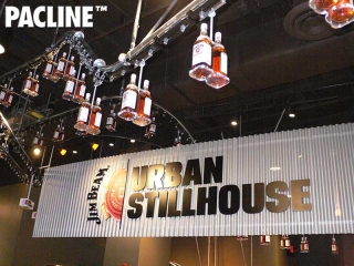 Jim Beam uses a Pacline creative retail conveyor to produce a unique bottling display.