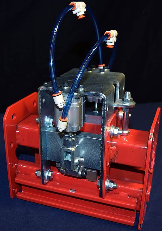 Double blade power and free conveyor stop device.