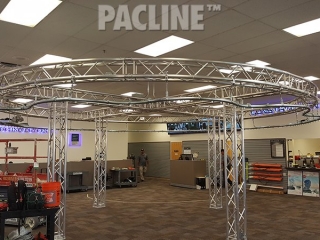 PAC-LINE™ enclosed track conveyor for a drone creative display system.