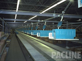 Delivery of plastic totes to picking module, the PAC-LINE™  overhead conveyor.