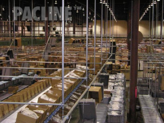 Tote and carton delivery to packing areas using single hooks, the PAC-LINE™ enclosed track conveyor system.
