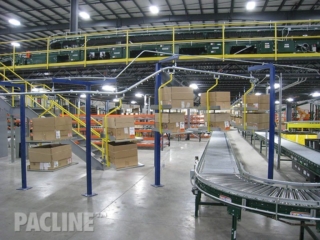 Empty carton and tote conveyor for split-case picking operations.