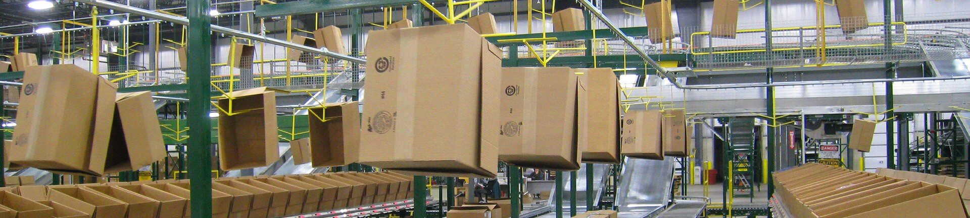 overhead conveyor for empty carton delivery Overhead conveyor for empty carton delivery in split case picking operations.