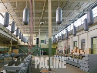 Munitions being conveyed by The PAC-LINE enclosed track overhead conveyor on the Bomb Girls assembly line movie set.