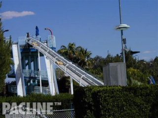 Water park sleds are transported by the PAC-LINE™ enclosed track conveyor to return them to the top of slide.