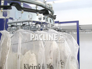 Specialty garment conveyor handles a load capacity of 100 lbs per dual pendant rack.