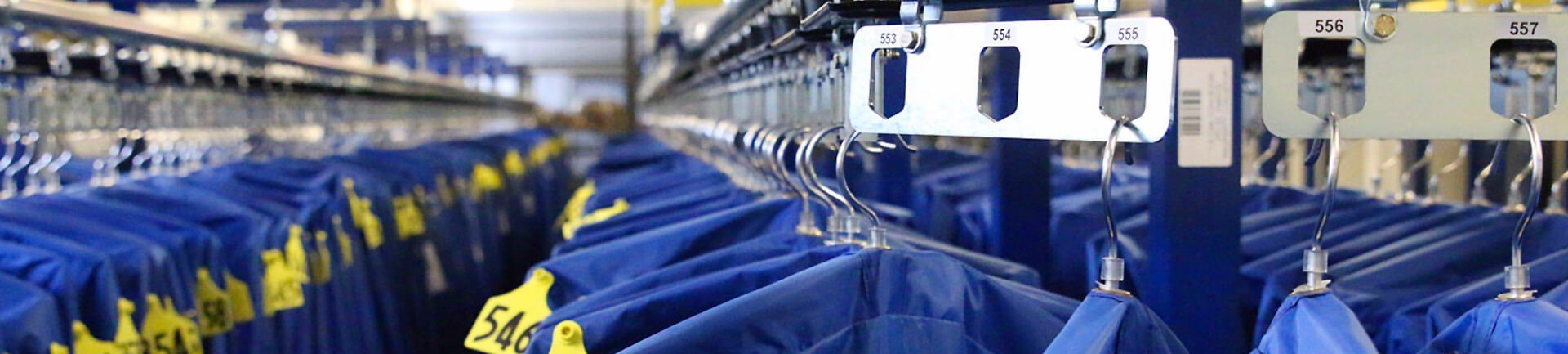 Garment handling conveyor systems for uniforms, inmate property and coat checks