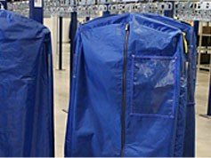 Bags for garment storage on a conveyor system.