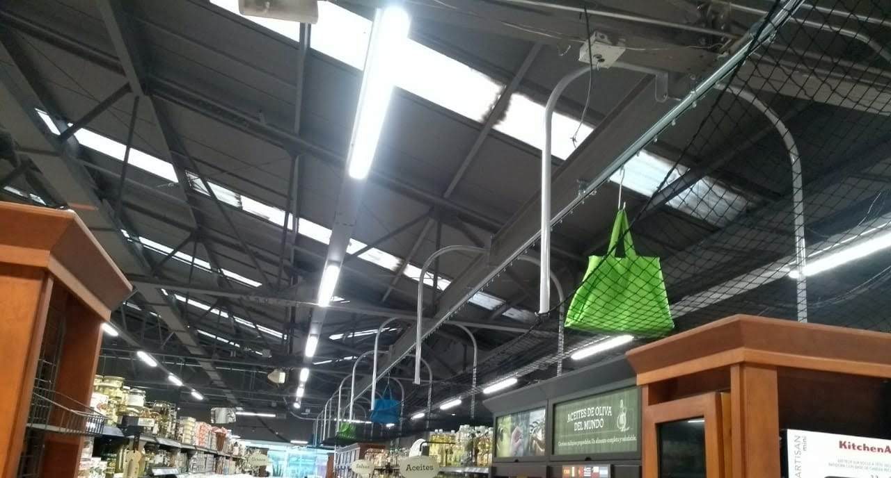 grocery store conveyor micro-fulfillment solution in a supermarket utilizing a conveyor