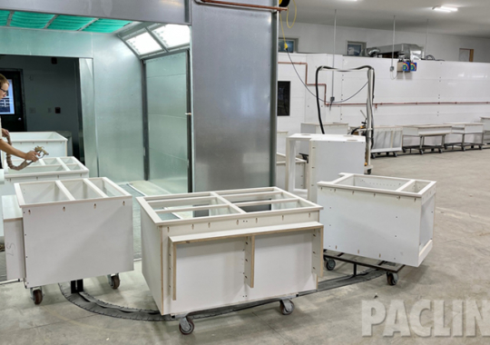 In-floor towline conveyor for custom wood finishing