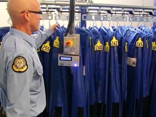 Conveyors for inmate property storage in correctional centers