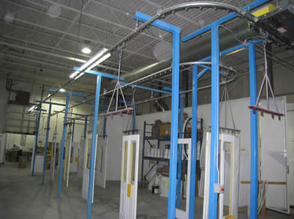 Inexpensive door finishing monorail conveyor system