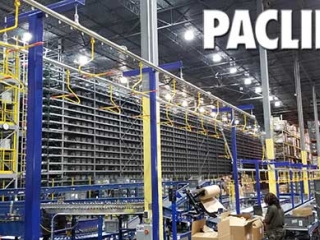 Carriers on overhead conveyor for delivering empty totes.