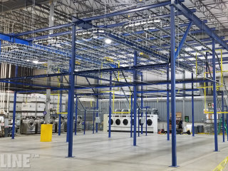 Conveyor for air drying military vests before final production