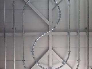 PAC-LINE™ enclosed track conveyor for painting door seals.