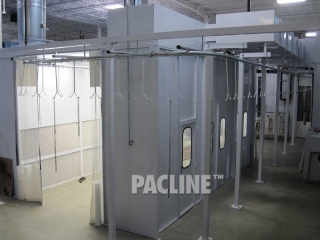 The PAC-LINE overhead enclosed track conveyor goes through a paint booth system.