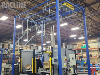 Overhead conveyor for transporting in-process parts