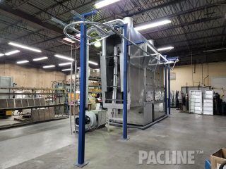 Overhead conveyor for a washer system