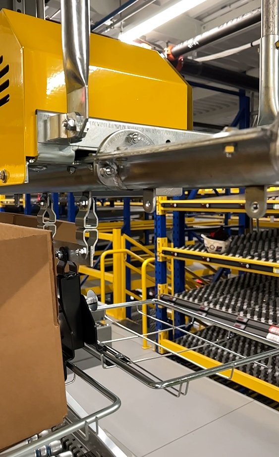 overhead monorails in pick modules for empty carton induction