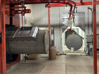 Heavy tank finishing line utlilizing overhead conveyor system