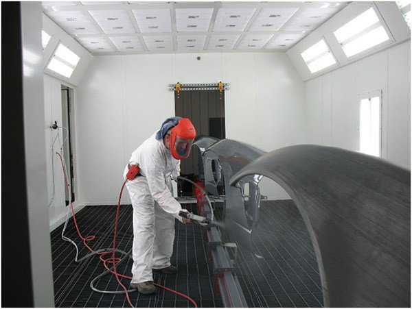 Heavy duty inverted conveyor for wet spray paint line. 