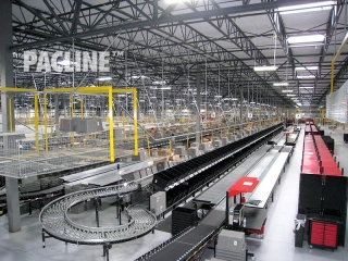 Packing area monorail delivers plastic totes and removes reusable and trash cartons.