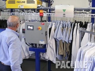 Automated uniform conveyor for large hotels, casinos and resorts.