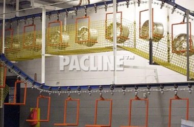 Pacline I-beam conveyor used to transport wheel rims through wash process before electroplating.