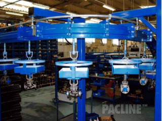 Overhead conveyor PAC-MAX carries industrial valves through paint line process.