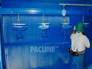 Hydraulic valves are moved through hand spray paint process using a heavy duty PAC-MAX conveyor.
