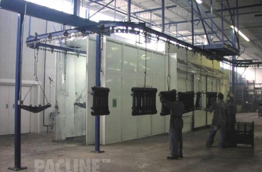 A 4 inch I-beam overhead conveyor used in wet spraying of heavy truck suspension components.