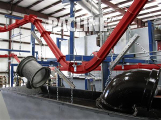 PAC-MAX conveyor can handle sharp inclines to carry these heavy pipe fittings through paint dip line.